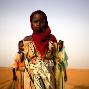 Women, young girls and boys leave an IDP camp to gather firewood. For some the work will take over 7 hours and lead them past government checkpoints and leave them exposed to attacks.

All the people express fear and wish there was a more secure way to gather wood, essential for cooking in the camp.

Girls as young as 8 have been raped, attacked and killed trying to get wood.